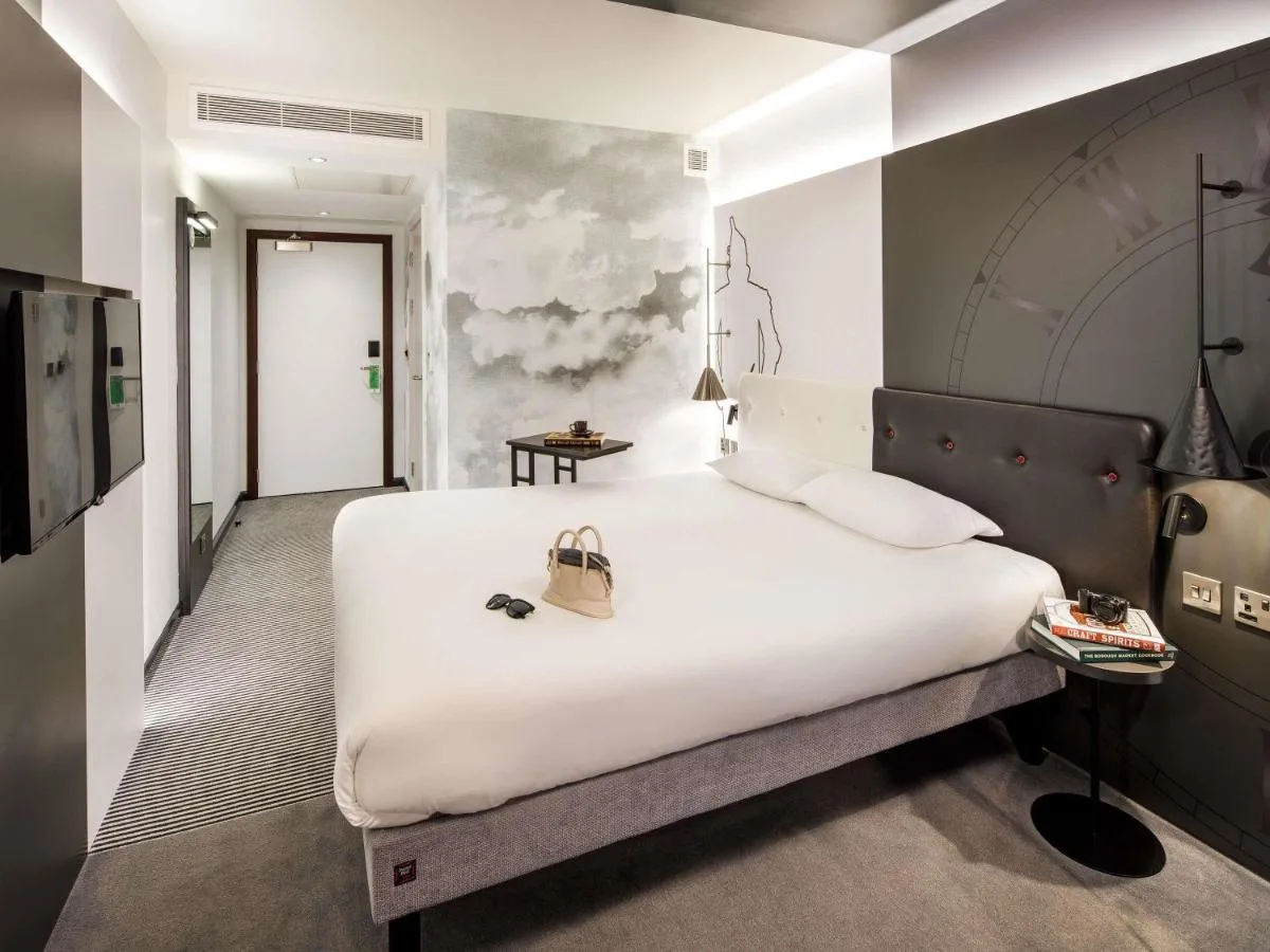 Large white bed in a guest room